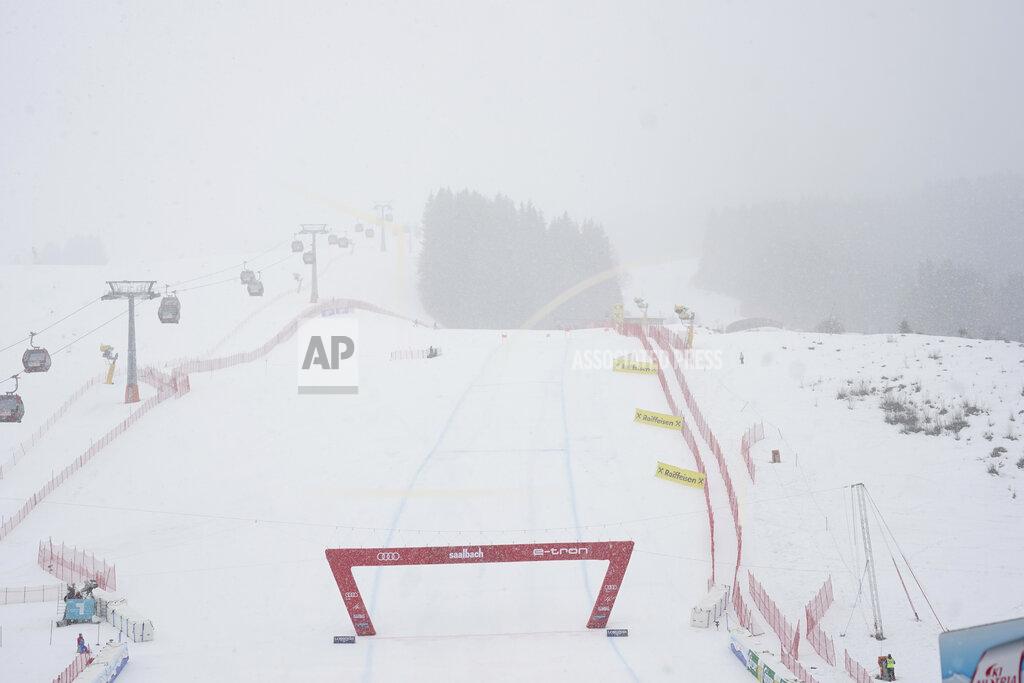Giovanni Auletta The course of an alpine ski, men's World Cup downhill, disappears in the fog as race is interrupted in Saalbach-Hinterglemm, Austria, Friday, March 5, 2021. (AP Photo/Giovanni Auletta)