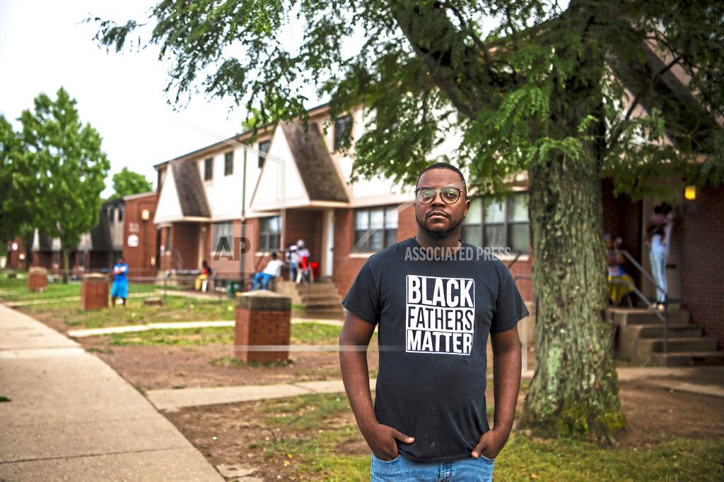 Alexandra Wimley Rev. Michael Day, of the Legacy International Worship Center, stands for a portrait in Northview Heights, Wednesday, Aug. 11, 2021 in Pittsburgh. Day is making it his mission to work with the city and group violence outreach workers to address the needs of families in Northview Heights. He and church members planned to set up a tent in the neighborhood and try to connect residents to counseling, basic necessities and church ministries. (Alexandra Wimley/Pittsburgh Post-Gazette via AP)