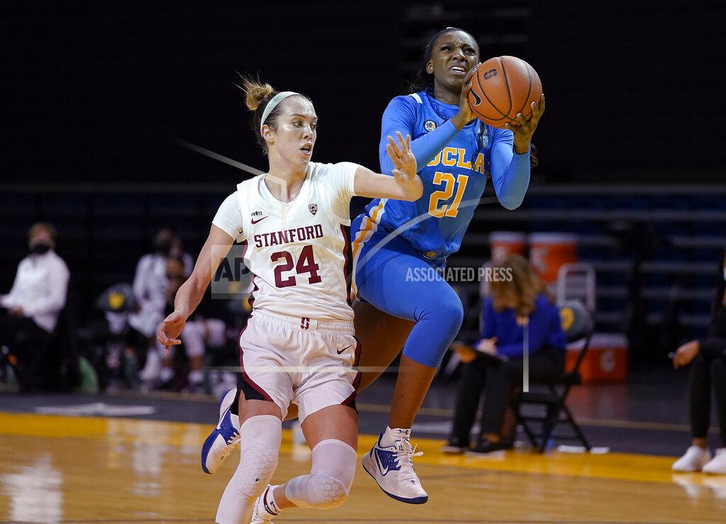 Tony Avelar FILE - In this Jan. 22, 2021, file photo, UCLA forward Michaela Onyenwere (21) is fouled by Stanford guard Lacie Hull (24) during the second half of an NCAA college basketball game in Santa Cruz, Calif. New York chose Onyenwere with the sixth pick in the WNBA draft Thursday, April 15. (AP Photo/Tony Avelar, File)