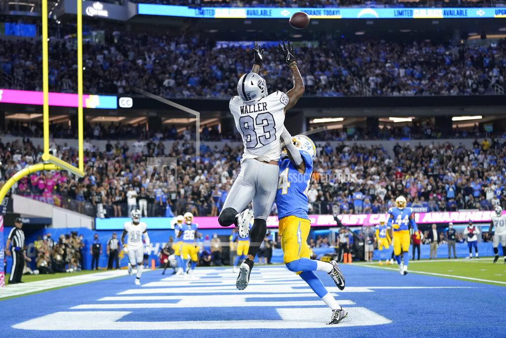 Ashley Landis Las Vegas Raiders tight end Darren Waller (83) hauls in a pass in the end zone for a touchdown as Los Angeles Chargers defensive back Nasir Adderley defends during the second half of an NFL football game Monday, Oct. 4, 2021, in Inglewood, Calif. (AP Photo/Ashley Landis)