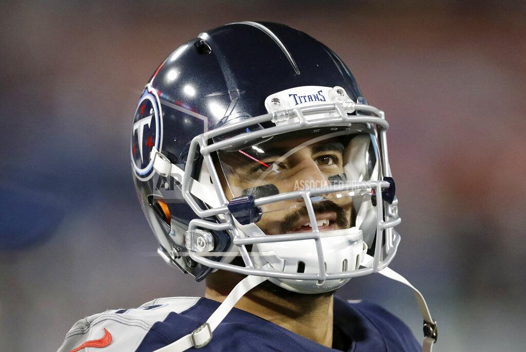 James Kenney FILE - In this Nov. 24, 2019, file photo, Tennessee Titans quarterback Marcus Mariota looks at the scoreboard in the second half of an NFL football game against the Jacksonville Jaguars in Nashville, Tenn. The Tennessee Titans benched Mariota for Ryan Tannehill in mid-October after a 2-4 start. (AP Photo/James Kenney, File)