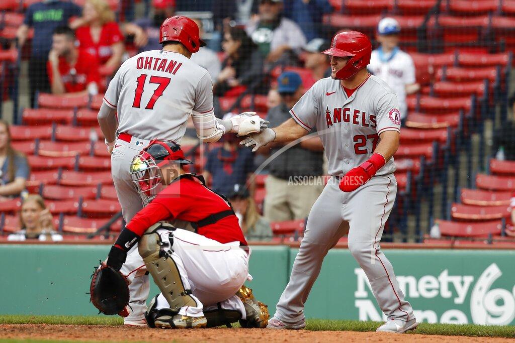 Michael Dwyer Los Angeles Angels' Shohei Ohtani (17) celebrates his two-run home run that also drove in Mike Trout (27) as Boston Red Sox's Christian Vazquez kneels at home plate during the ninth inning of a baseball game, Sunday, May 16, 2021, in Boston. (AP Photo/Michael Dwyer)