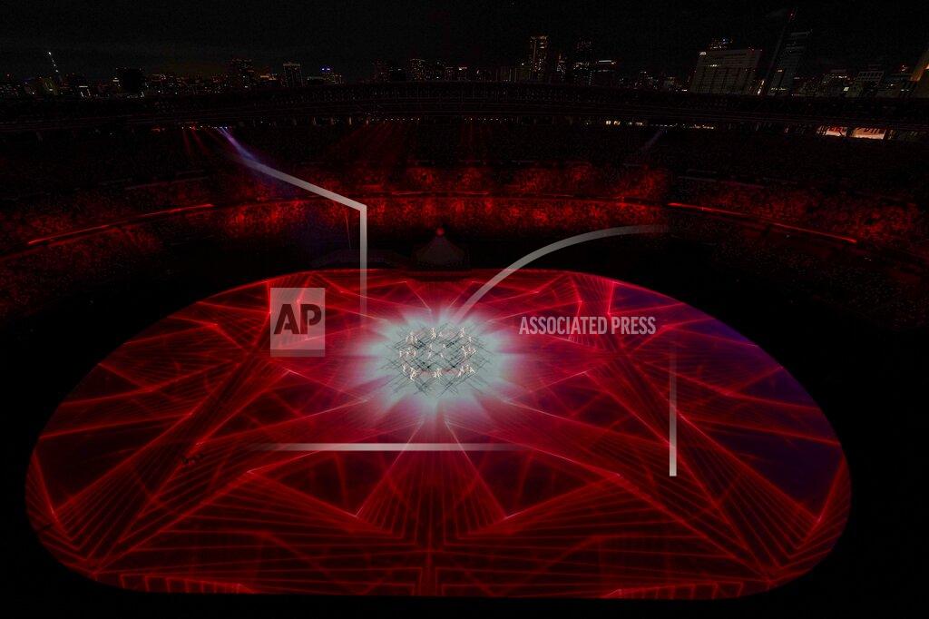 David J. Phillip Dancers are seen during the opening ceremony at the Olympic Stadium at the 2020 Summer Olympics, Friday, July 23, 2021, in Tokyo. (AP Photo/David J. Phillip)