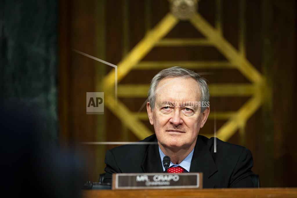 Al Drago Chairman Mike Crapo, R-Idaho, listens as Federal Reserve Chair Jerome Powell and Treasury Secretary Steven Mnuchin, not pictured, testify during a Senate Banking Committee hearing on Capitol Hill, on Tuesday, Dec. 1, 2020, in Washington. (Al Drago/The New York Times via AP, Pool)