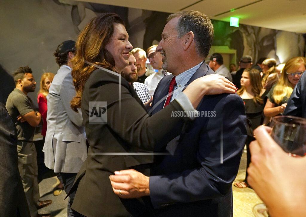 Rich Pedroncelli FILE - Republican gubernatorial candidate, state Sen. Brian Dahle, right, hugs his wife Assemblywoman Megan Dahle, in celebration at an election night gathering in Sacramento, Calif., June 7, 2022. Sen. Dahle finished second in California's primary on June 7, and knows it will be hard to defeat incumbent Democratic Gov. Gavin Newsom. He plans to focus on what he says are the problems people care about the most, including high gas prices and rising crime. (AP Photo/Rich Pedroncelli, File)