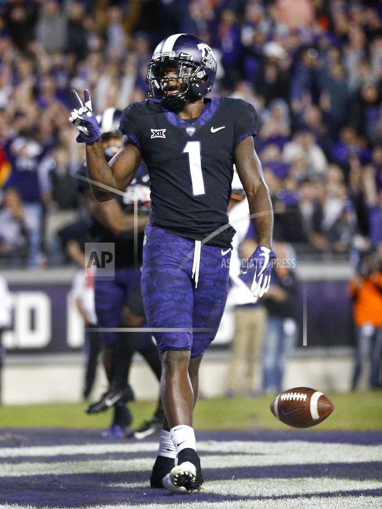 Tom Fox TCU wide receiver Jalen Reagor (1) gestures after scoring a second-quarter touchdown during an NCAA college football game against Oklahoma in Fort Worth, Texas, Saturday, Nov. 24, 2018. (Tom Fox/The Dallas Morning News via AP)