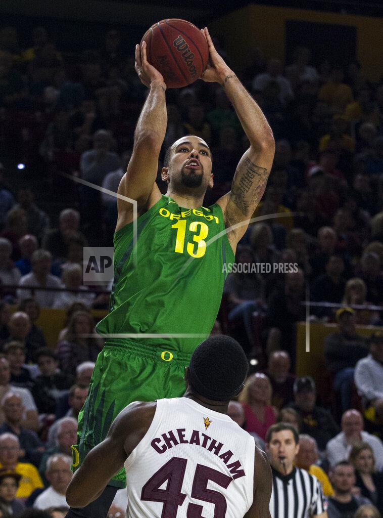 Darryl Webb Oregon's Paul White (13) puts up a shot against Arizona State's Zylan Cheatham (45) during the first half of an NCAA college basketball game Saturday, Jan. 19, 2019, in Tempe, Ariz. (AP Photo/Darryl Webb)