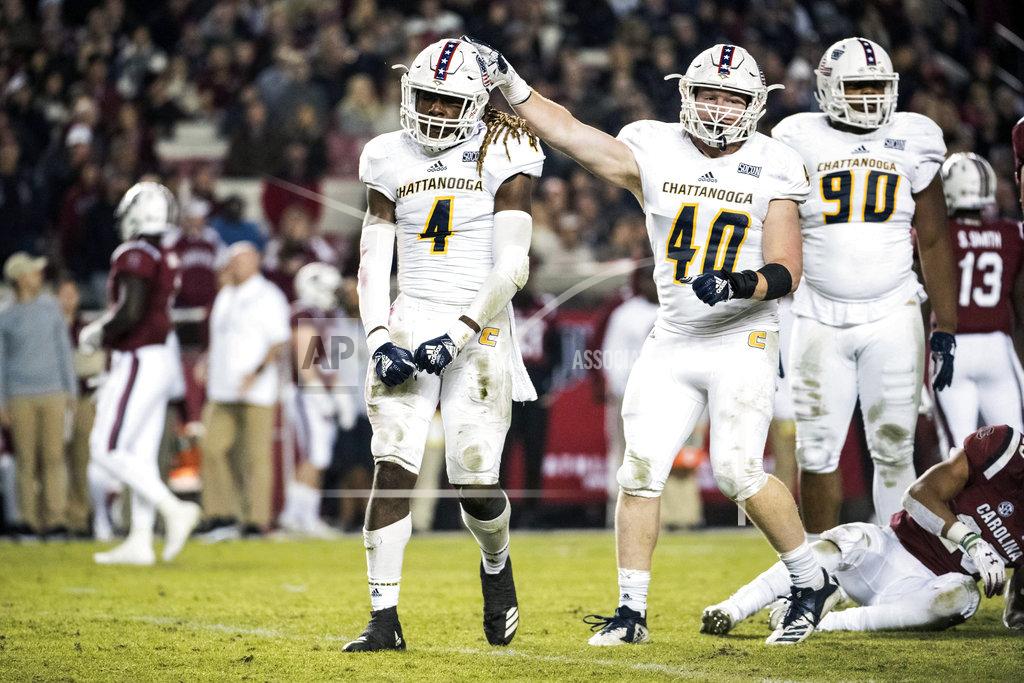 Sean Rayford Chattanooga linebacker Tavon Lawson (4) and Marshall Cooper (40) celebrate a defensive play during the first half of an NCAA college football game against South Carolina, Saturday, Nov. 17, 2018, in Columbia, S.C. (AP Photo/Sean Rayford)