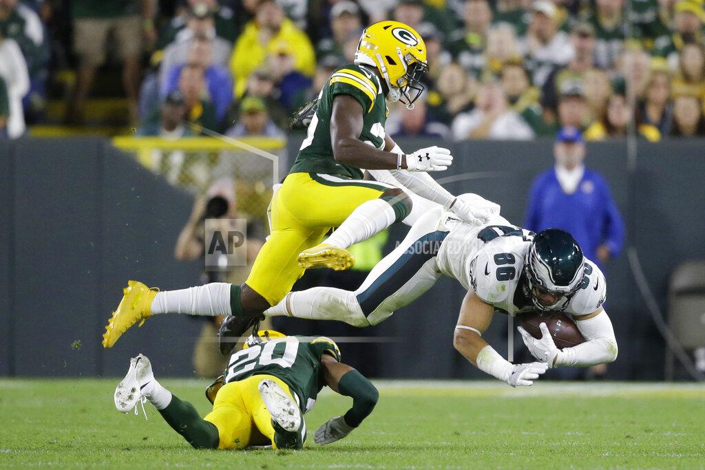 Jeffrey Phelps Philadelphia Eagles tight end Zach Ertz (86) is taken off his feet by Green Bay Packers cornerback Kevin King (20) after completing a catch during the second half of an NFL football game Thursday, Sept. 26, 2019, in Green Bay, Wis. (AP Photo/Jeffrey Phelps)