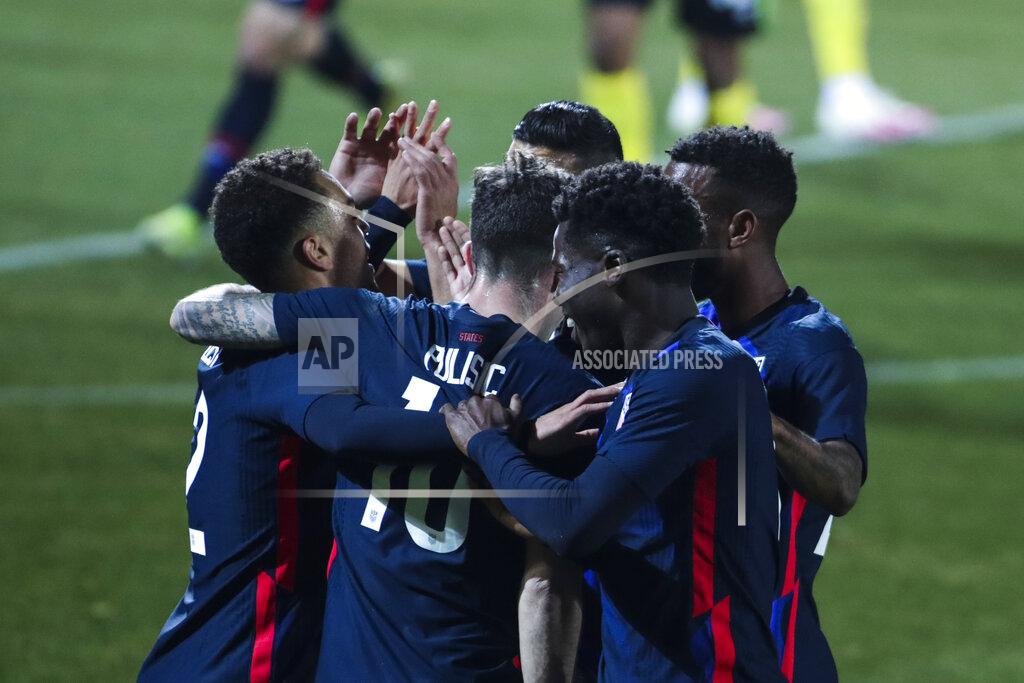 Ronald Zak US players celebrate after scoring the opening goal during the international friendly soccer match between USA and Jamaica at SC Wiener Neustadt stadium in Wiener Neustadt, Austria, Thursday, March 25, 2021. (AP Photo/Ronald Zak)