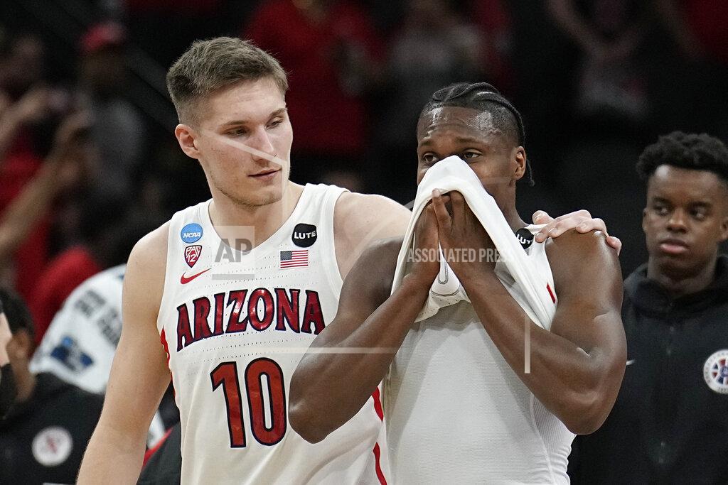 Eric Gay Arizona forward Azuolas Tubelis and guard Bennedict Mathurin leave the court after their loss to Houston in a college basketball game in the Sweet 16 round of the NCAA tournament on Thursday, March 24, 2022, in San Antonio. (AP Photo/Eric Gay)