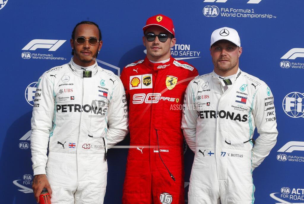 Antonio Calanni Ferrari driver Charles Leclerc of Monaco, who clocked the fastest time, poses between runner-up Mercedes driver Lewis Hamilton of Britain and third fastest Mercedes driver Valtteri Bottas of Finland, after the qualifying session at the Monza racetrack, in Monza, Italy, Saturday, Sept. 7, 2019. The Formula one race will be held on Sunday. (AP Photo/Antonio Calanni)