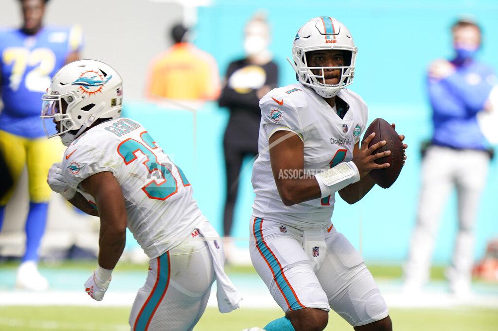 Wilfredo Lee Miami Dolphins quarterback Tua Tagovailoa (1) looks to throw his first complete pass during the first half of an NFL football game against the Los Angeles Rams, Sunday, Nov. 1, 2020, in Miami Gardens, Fla. (AP Photo/Wilfredo Lee)