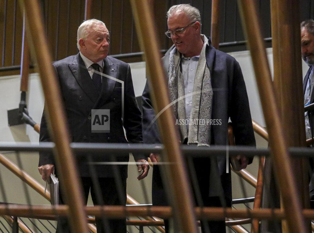 Dallas Cowboys owner Jerry Jones, left, and his son Stephen Jones, the team's executive vice president, leave after NFL owners meet to discuss a proposed labor agreement, Thursday Feb. 20, 2020, in New York. (AP Photo/Bebeto Matthews)