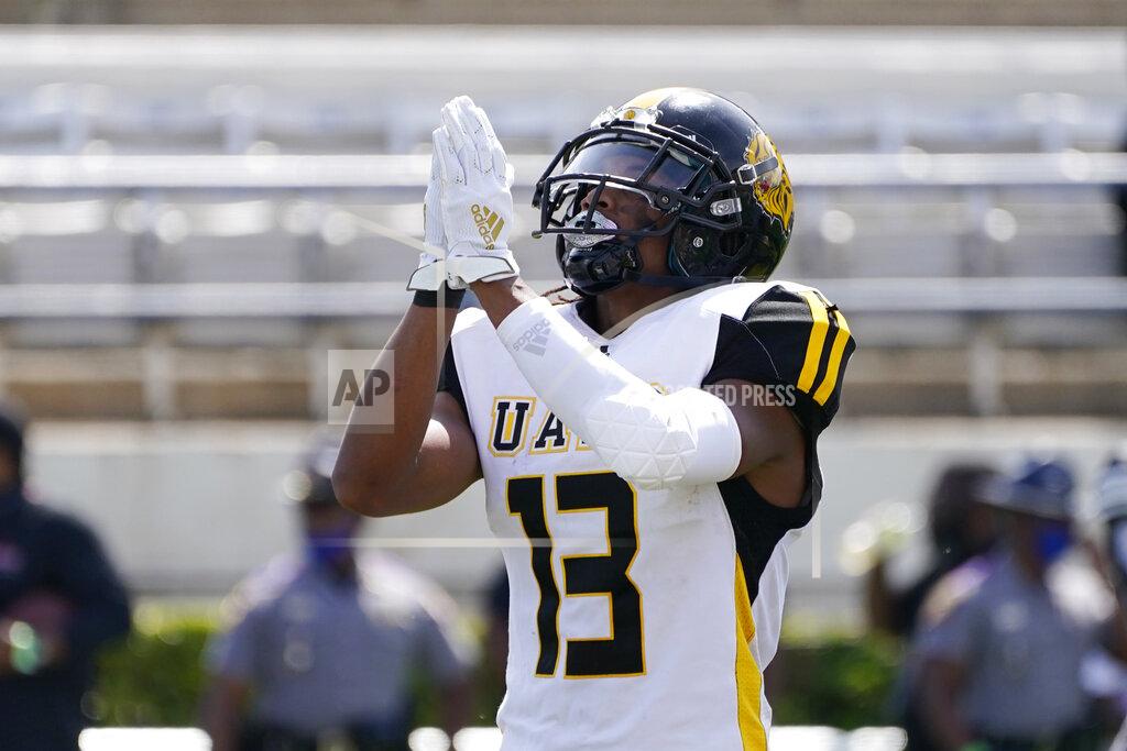 Rogelio V. Solis Arkansas-Pine Bluff wide receiver DeJuan Miller (13) celebrates his touchdown reception past an Alabama A&M defender during the first half of the Southwestern Athletic Conference NCAA college football game, Saturday, May 1, 2021, in Jackson, Miss. (AP Photo/Rogelio V. Solis)