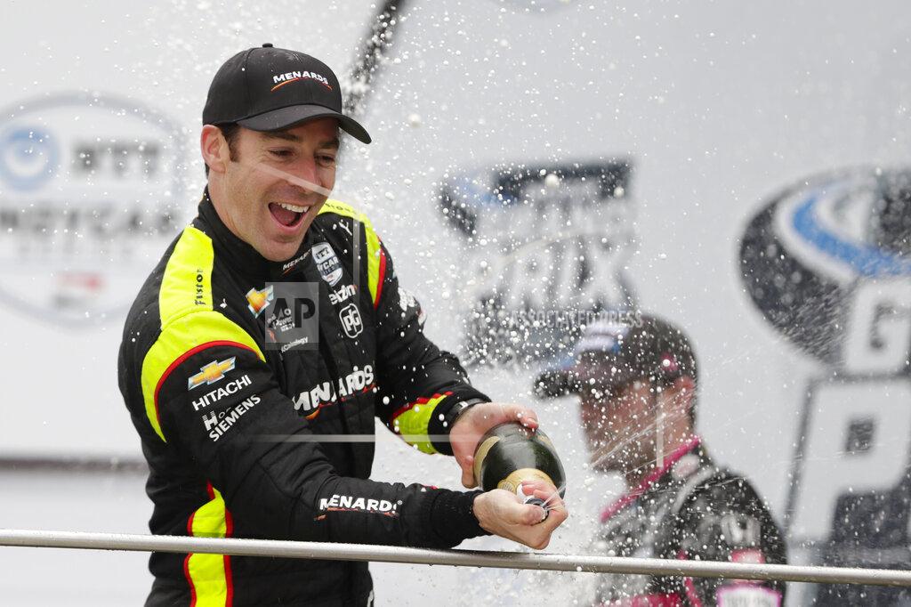 Michael Conroy Simon Pagenaud, of France, celebrates after winning the Indy GP IndyCar auto race at Indianapolis Motor Speedway, Saturday, May 11, 2019, in Indianapolis. (AP Photo/Michael Conroy)