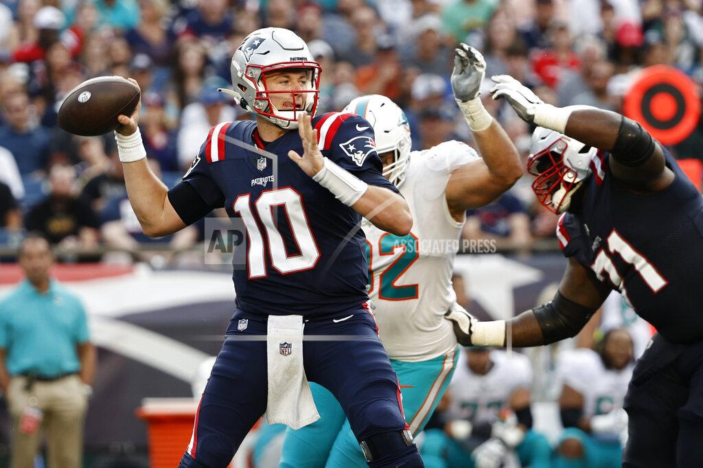 Winslow Townson New England Patriots quarterback Mac Jones (10) looks to pass during the first half of an NFL football game against the Miami Dolphins, Sunday, Sept. 12, 2021, in Foxborough, Mass. (AP Photo/Winslow Townson)