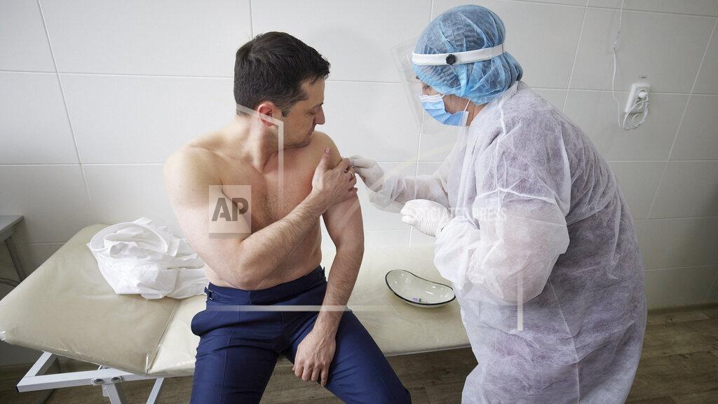 Uncredited In this handout photo provided by the Ukrainian Presidential Press Office, Ukrainian President Volodymyr Zelensky receives a dose of the AstraZeneca vaccine, marketed under the name CoviShield, as he visits the war-hit Luhansk region, eastern Ukraine, Tuesday, March 2, 2021. (Ukrainian Presidential Press Office via AP)