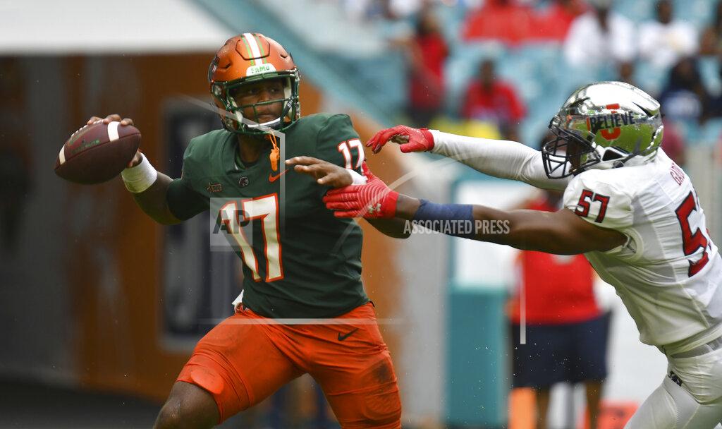 Jim Rassol Florida A&M quarterback Rasean McKay (17) is pressured by Jackson State linebacker Nyles Gaddy (57) in the first quarter of an NCAA college football game, Sunday, Sept. 5, 2021, in Miami Gardens, Fla. (AP Photo/Jim Rassol)