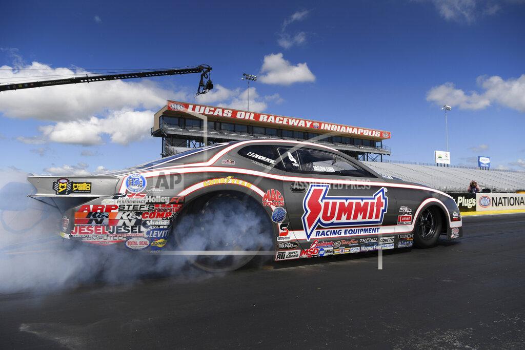 In this photo provided by the NHRA, Pro Stock veteran Jason Line starts the day from the No. 1 spot then went on to pick up the win when he took out Jeg Coughlin at the E3 Spark Plugs NHRA Nationals in Indianapolis, Sunday, July 12, 2020. (Jerry Foss/NHRA via AP)