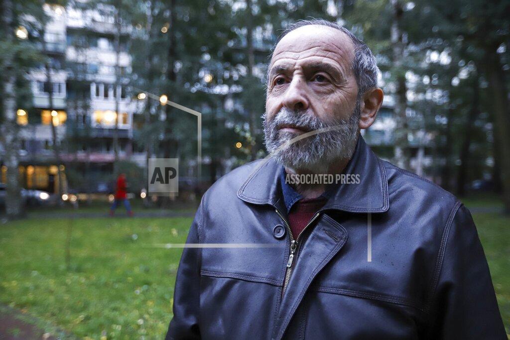 Ivan Petrov Boris Vishnevsky of the Yabloko party who is running for both the State Duma and the regional legislature in St. Petersburg, Russia, speakes to journalists on Wednesday, Sept. 15, 2021. Vishnevsky discovered that there are two other men running in both races under the same name as him. One of his opponents is from the ruling United Russia party, according to the newspaper Novaya Gazeta. (AP Photo/Ivan Petrov)