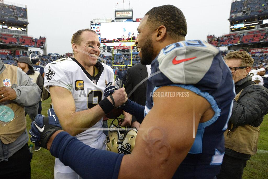 Mark Zaleski New Orleans Saints quarterback Drew Brees (9) talks with Tennessee Titans inside linebacker Wesley Woodyard (59) after an NFL football game Sunday, Dec. 22, 2019, in Nashville, Tenn. The Saints won 38-28. (AP Photo/Mark Zaleski)
