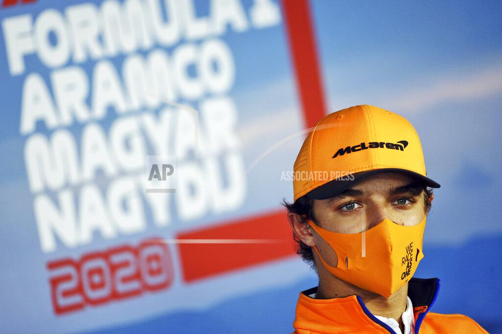 Mclaren driver Lando Norris of Britain attends drivers news conference at the Hungaroring racetrack in Mogyorod, Hungary, Thursday, July 16, 2020. The Hungarian Formula One Grand Prix race will take place on Sunday. (FIA Pool via AP)