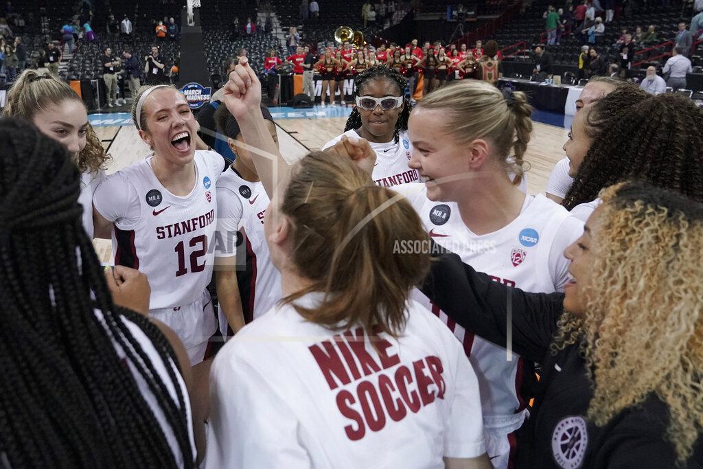 Ted S. Warren Stanford players, including Lexie Hull (12) react in the huddle after a college basketball game against Maryland in the Sweet 16 round of the NCAA tournament, Friday, March 25, 2022, in Spokane, Wash. Stanford won 72-66. (AP Photo/Ted S. Warren)