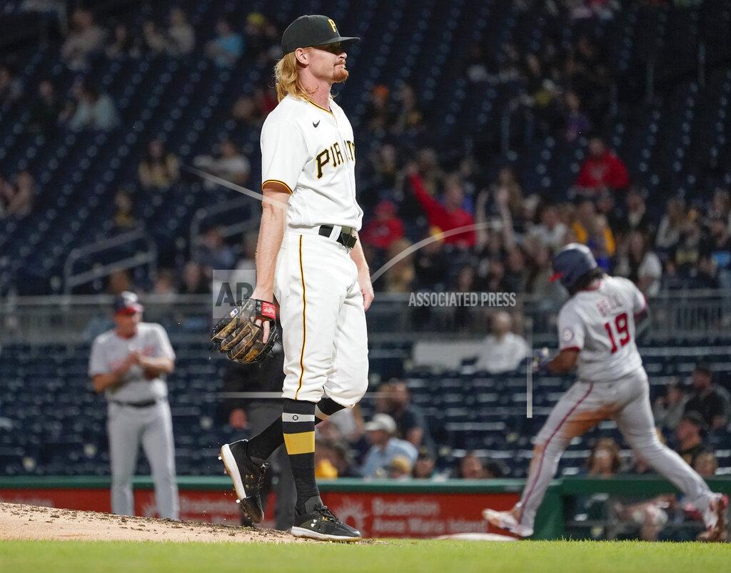 Keith Srakocic Pittsburgh Pirates relief pitcher Sam Howard, center, awaits a new ball as Washington Nationals' Josh Bell (19) runs the bases after hitting a solo home run during the sixth inning of a baseball game Friday, Sept. 10, 2021, in Pittsburgh. Nationals first base coach Randy Knorr is at left. (AP Photo/Keith Srakocic)