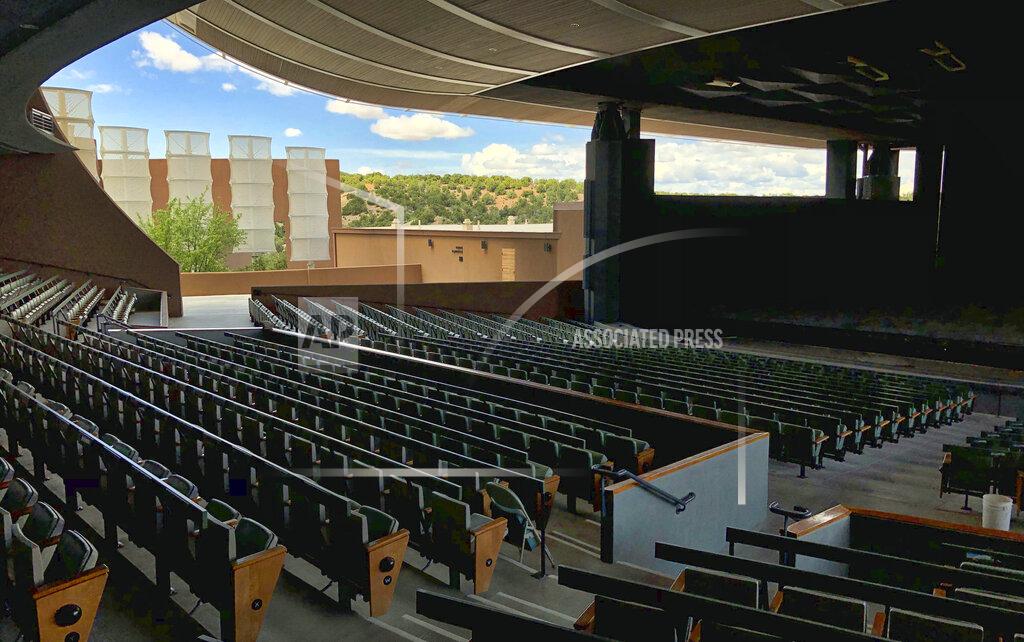 FILE - In this May 8, 2019, file photo, the Santa Fe Opera awaits its summer season in Santa Fe, N.M. The gates at the famed Santa Fe Opera are opening again. General Director Robert Meya said Wednesday, June 2, 2021, during a news conference that he and the entire company are excited to return to the stage next month. (AP Photo/Morgan Lee, File)