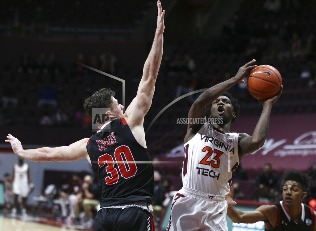 Matt Gentry Virginia Tech's Tyrece Radford (23) shoots past VMI's Sean Conway (30) during the first half of an NCAA college basketball game in Blacksburg, Va., Thursday, Dec. 3 2020. (Matt Gentry/The Roanoke Times via AP, Pool)