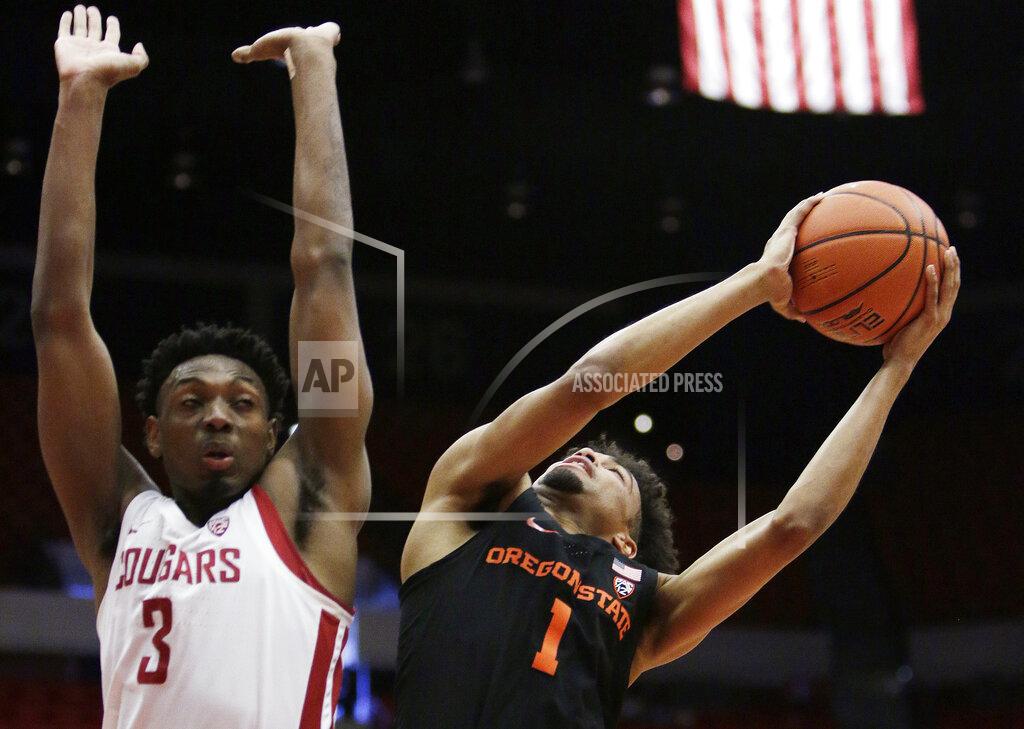 Young Kwak Oregon State guard Stephen Thompson Jr. (1) shoots while defended by Washington State forward Robert Franks Jr. (3) during the first half of an NCAA college basketball game in Pullman, Wash., Saturday, March 9, 2019. (AP Photo/Young Kwak)