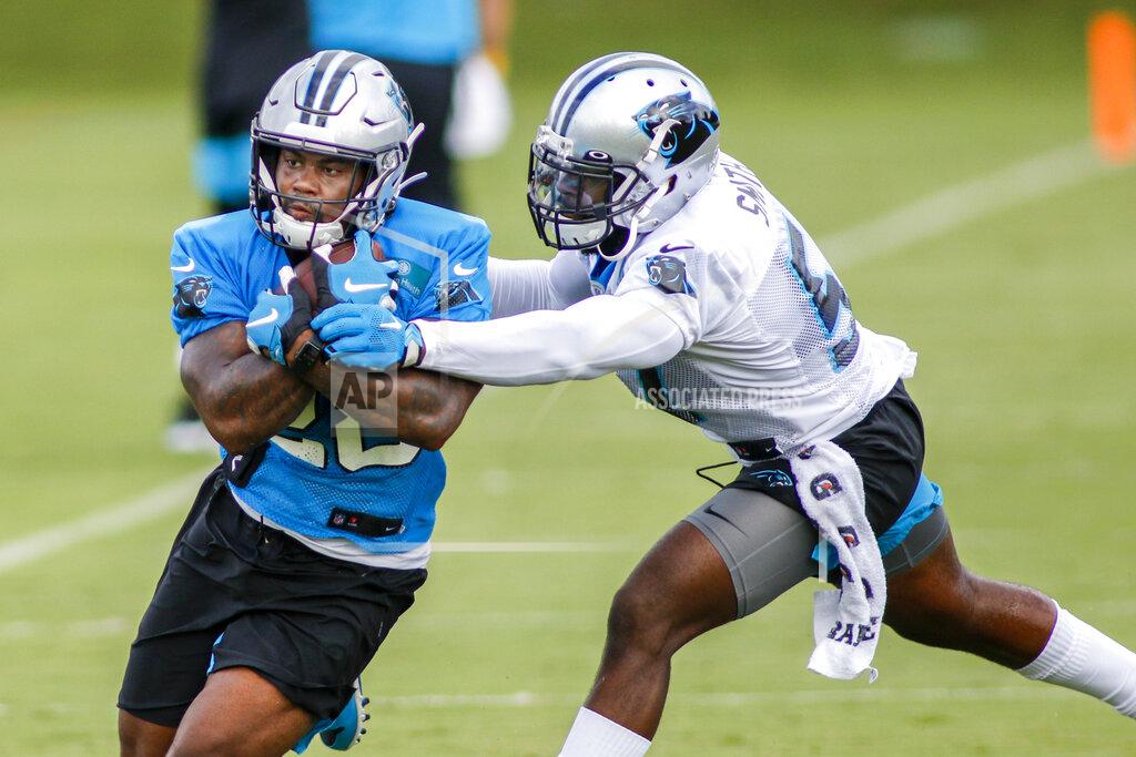 Nell Redmond Carolina Panthers running back Mike Davis, left, pulls in a catch against Carolina Panthers linebacker Andre Smith during NFL football training camp practice Sunday, Aug. 16, 2020 in Charlotte, N.C. (AP Photo/Nell Redmond)