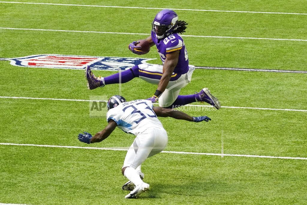 Jim Mone Minnesota Vikings running back Alexander Mattison (25) leaps over Tennessee Titans cornerback Johnathan Joseph (33) during the second half of an NFL football game, Sunday, Sept. 27, 2020, in Minneapolis. (AP Photo/Jim Mone)
