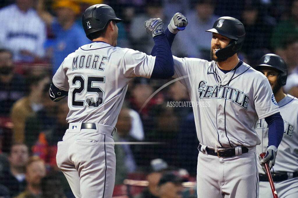 Charles Krupa Seattle Mariners' Dylan Moore (25) is congratulated by Steven Souza Jr. after his three-run home run against the Boston Red Sox during the second inning of a baseball game at Fenway Park, Thursday, May 19, 2022, in Boston. (AP Photo/Charles Krupa)