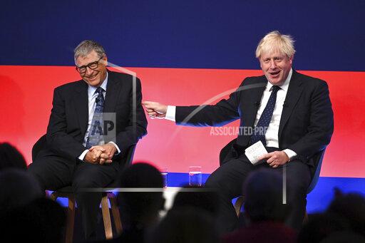 Britain's Prime Minister Boris Johnson, right, appears on stage in conversation with American Businessman Bill Gates during the Global Investment Summit at the Science Museum, London, Tuesday, Oct, 19, 2021. (Leon Neal/Pool Photo via AP)