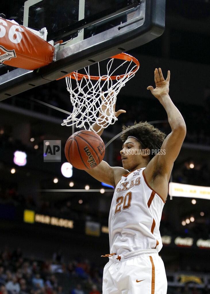 Charlie Riedel FILE - In this March 7, 2018, file photo, Texas' Jericho Sims dunks during the second half of the team's NCAA college basketball game against Iowa State in the Big 12 men's tournament in Kansas City, Mo. Sims will either deliver on the potential as wide as his broad shoulders, or he will lose out to incoming freshmen Will Baker and Kai Jones. (AP Photo/Charlie Riedel, File)