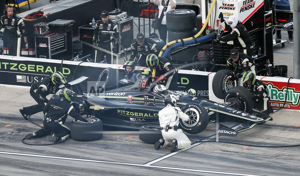 Brandon Wade Josef Newgarden makes a pit stop during the IndyCar auto race at Texas Motor Speedway, Saturday, June 8, 2019, in Fort Worth, Texas. (AP Photo/Brandon Wade)