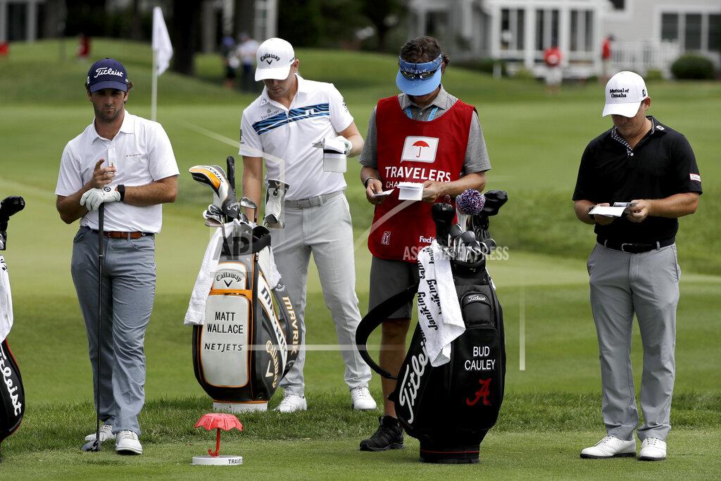 Frank Franklin Ii In this Thursday, June 25, photo, Denny McCarthy, left, Matt Wallace, center left, Bud Cauley, right, and Cauley's caddie Matt Hauser stand at the third tee box during the first round of the Travelers Championship golf tournament at TPC River Highlands in Cromwell, Conn. McCarthy told Golfchannel.com that he withdrew from the tournament after feeling sick Thursday night and testing positive for the coronavirus on Friday. Cauley, who played with McCarthy on Thursday, also withdrew before Friday's second round. McCarthy became the third PGA Tour player to test positive for the virus since its restart and the second this week, joining Cameron Champ who withdrew on Tuesday. Nick Watney withdrew just before the second round of last week's RBC Heritage Championship. (AP Photo/Frank Franklin II)