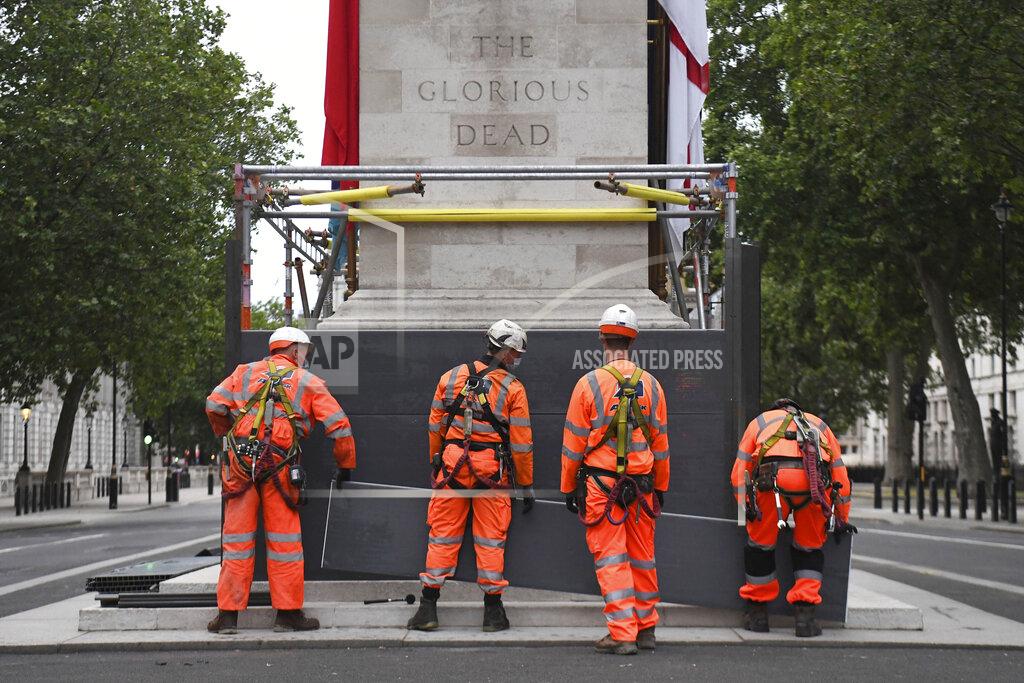 Kirsty O'connor Scaffolders erect boarding around the Cenotaph on Whitehall, in London, Thursday, June 11, 2020, following Black Lives Matter protests that took place across the U.K. over the weekend. The protests were ignited by the death of George Floyd, a black man, who died after he was restrained in Minneapolis police custody on May 25 in the U.S. (Kirsty O'Connor/PA via AP)
