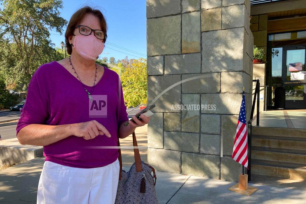 Jocelyn Gecker Janet Webb, 69, stands outside the Veterans Memorial Building after voting to recall California Gov. Gavin Newsom in Lafayette, Calif., on Tuesday, Sept. 14, 2021. Webb voted for Larry Elder because of Newsom's stance on vaccine mandates. "I am angry. It should be a freedom of choice, what is this a dictatorship? I've had it. I've never felt so angry. I'm losing all my friends and family, they don't want to have anything to do with me right now," she said. (AP Photo/Jocelyn Gecker)
