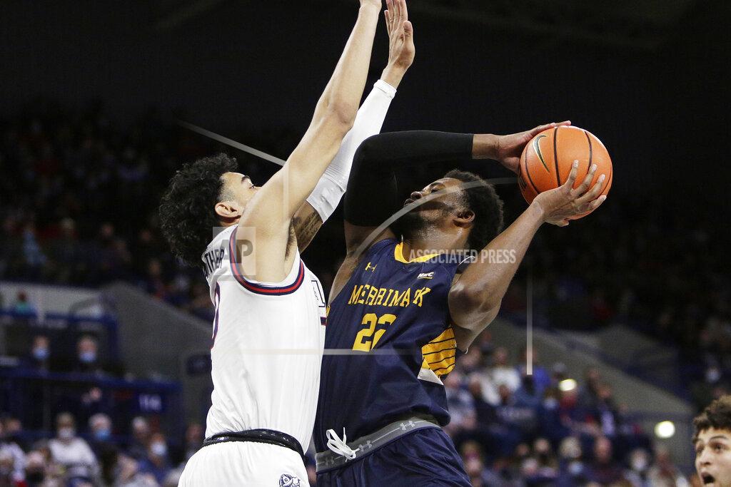 Young Kwak Merrimack forward Jordan Minor, right, shoots while defended by Gonzaga guard Julian Strawther during the first half of an NCAA college basketball game Thursday, Dec. 9, 2021, in Spokane, Wash. (AP Photo/Young Kwak)