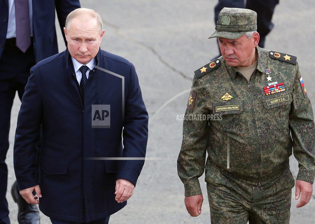 Sergei Savostyanov Russian President Vladimir Putin, left, and Russian Defense Minister Sergei Shoigu arrive to attend the joint strategic exercise of the armed forces of the Russian Federation and the Republic of Belarus Zapad-2021 at the Mulino training ground in the Nizhny Novgorod region, Russia, Monday, Sept. 13, 2021. The military drills attend by servicemen of military units and divisions of the Western Military District, representatives of the leadership headquarters and personnel of military contingents of the armed forces of Armenia, Belarus, India, Kazakhstan, Kyrgyzstan and Mongolia. (Sergei Savostyanov, Sputnik, Kremlin Pool Photo via AP)