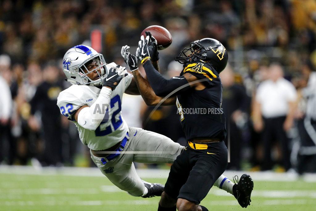 Gerald Herbert Middle Tennessee defensive back Cordell Hudson (22) breaks up a pass in the hands of Appalachian State wide receiver Dominique Heath (4), causing an interception, in the second half of the New Orleans Bowl NCAA college football game in New Orleans, Saturday, Dec. 15, 2018. Appalachian State won 45-13. (AP Photo/Gerald Herbert)