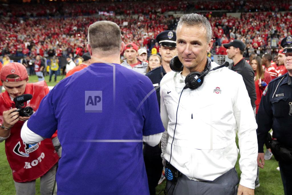 Aj Mast Ohio State head coach Urban Meyer, right, is congratulated by Northwestern head coach Pat Fitzgerald after Ohio State defeated Northwestern in the Big Ten championship NCAA college football game, Saturday, Dec. 1, 2018, in Indianapolis. Ohio State won 45-24. (AP Photo/AJ Mast)
