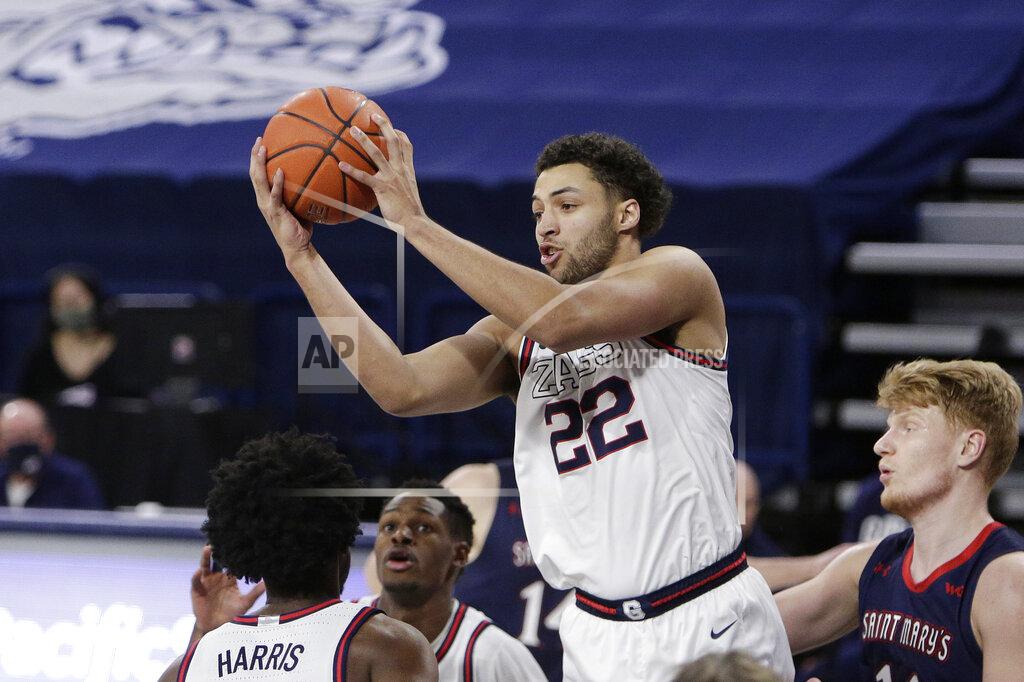 Young Kwak Gonzaga forward Anton Watson (22) grabs a rebound during the second half of an NCAA college basketball game against Saint Mary's in Spokane, Wash., Thursday, Feb. 18, 2021. Gonzaga won 87-65, (AP Photo/Young Kwak)
