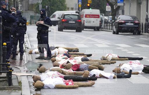 A view of dummies in a street to signify women who are suffering because of Poland's restrictive abortion law and a proposal for further restrictions, during a demonstration in front of parliament, in Warsaw, Poland, Tuesday, Nov. 30, 2021. Women’s rights activists used red paint symbolizing blood to protest a government plan to register every pregnancy in a national database and a proposal to further restrict abortion. The activists fear the database will allow authorities to track whether pregnancies end in a birth. Poland last year restricted its already conservative abortion law and abortions are now only allowed in cases of rape or incest, of if the woman’s life or health is in danger. (AP Photo/Czarek Sokolowski)
