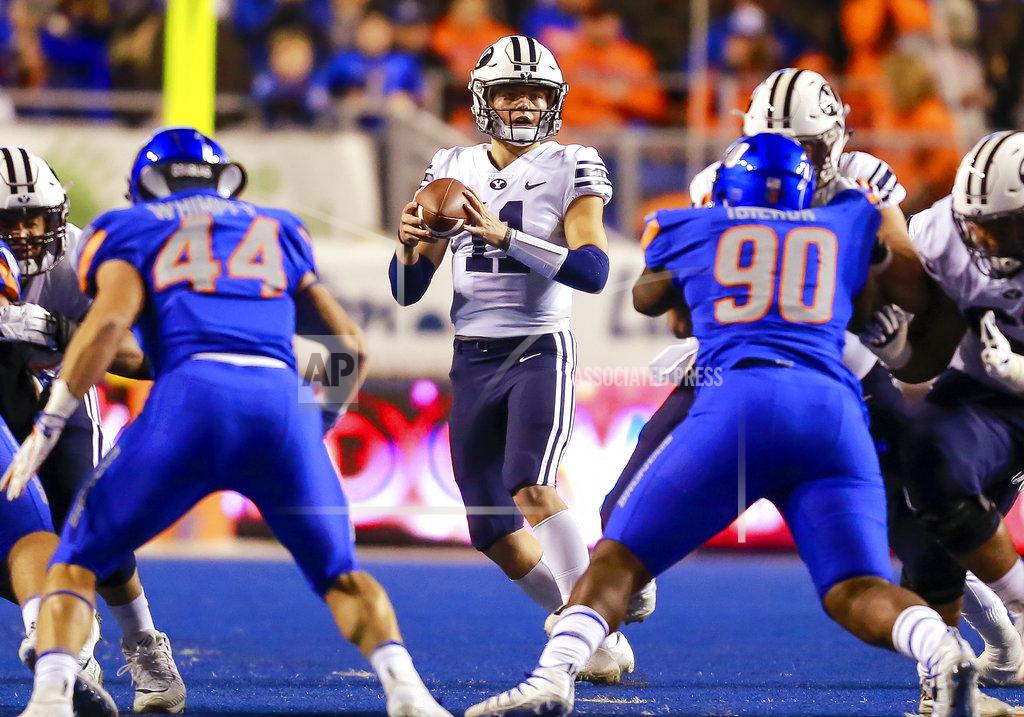 Steve Conner BYU quarterback Zach Wilson (11) looks for a receiver during the first half of an NCAA college football game against Boise State on Saturday, Nov. 3, 2018, in Boise, Idaho. (AP Photo/Steve Conner)