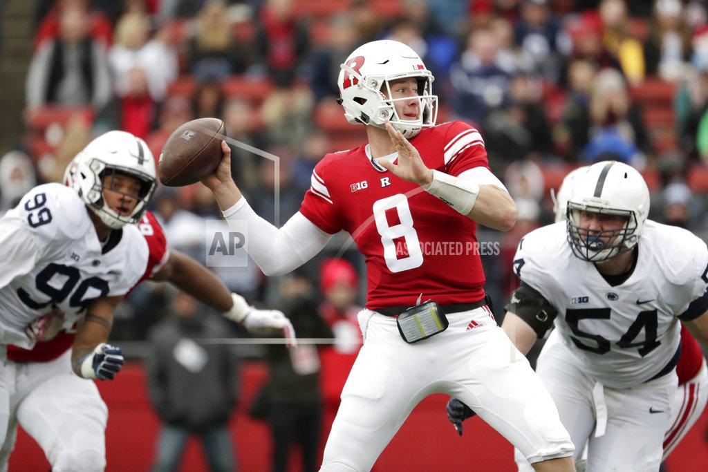 Julio Cortez Rutgers quarterback Artur Sitkowski (8) looks to pass as Penn State defensive end Yetur Gross-Matos (99) and defensive tackle Robert Windsor (54) rush in during the first half of an NCAA college football game, Saturday, Nov. 17, 2018, in Piscataway, N.J. (AP Photo/Julio Cortez)