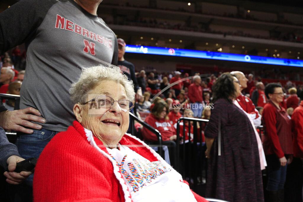 Nati Harnik 98-year-old Florence Dalby smiles at half time of an NCAA college basketball game between Ohio State and Nebraska, in Lincoln, Neb., Saturday, Jan. 26, 2019. Dalby is a University of Nebraska Lincoln graduate and has had a men's basketball season ticket for more than 80 years. Dalby loves Nebraska as much today as she did when she first started going to games in 1939. The Cornhuskers honored her during their Coaches Vs. Cancer game against Ohio State. (AP Photo/Nati Harnik)